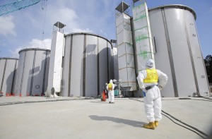 A worker in a protective suit at Fukushima Daiichi nuclear power plant last year.