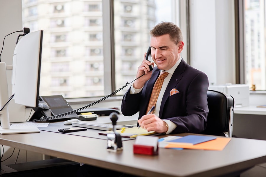 attorney Patrick Reddy on a phone call with a client