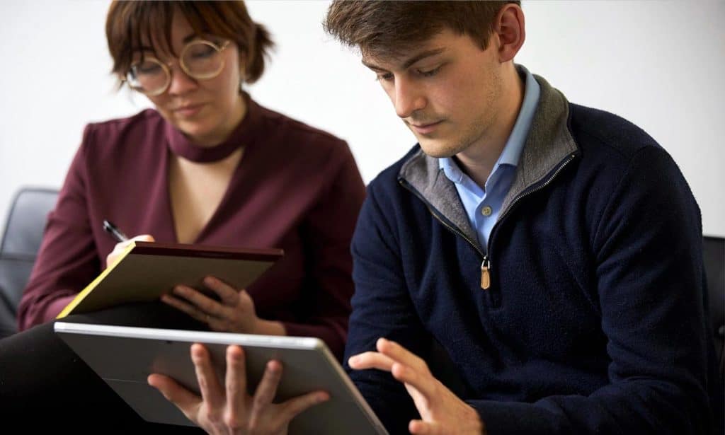 Two Individual professionals working on a L&I claim file.