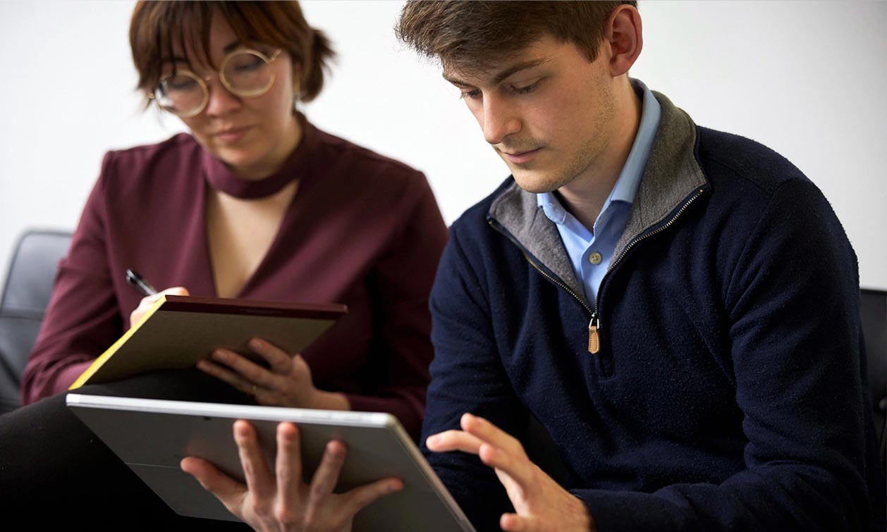 Two Individual professionals working on a L&I claim file.