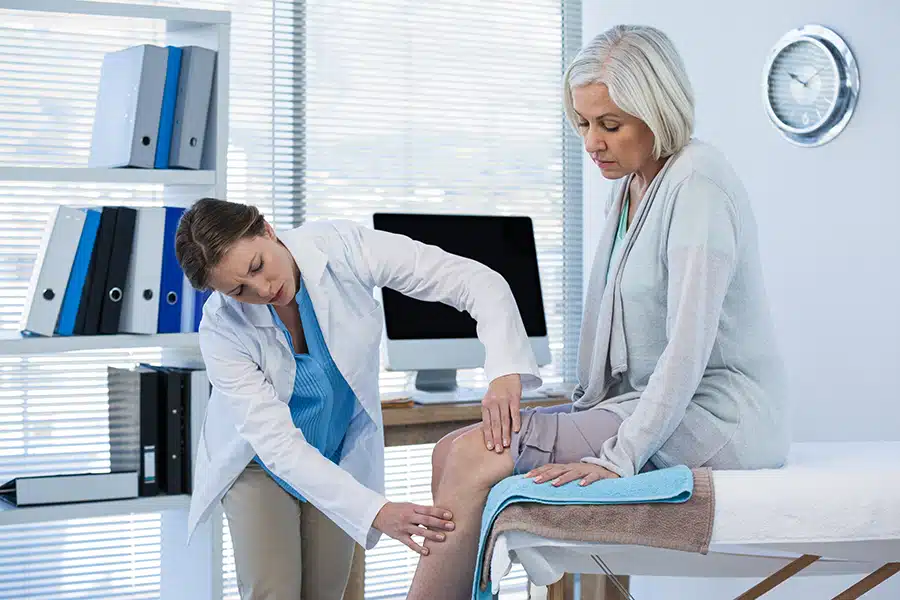 A doctor preforms a medical examination on a patient.