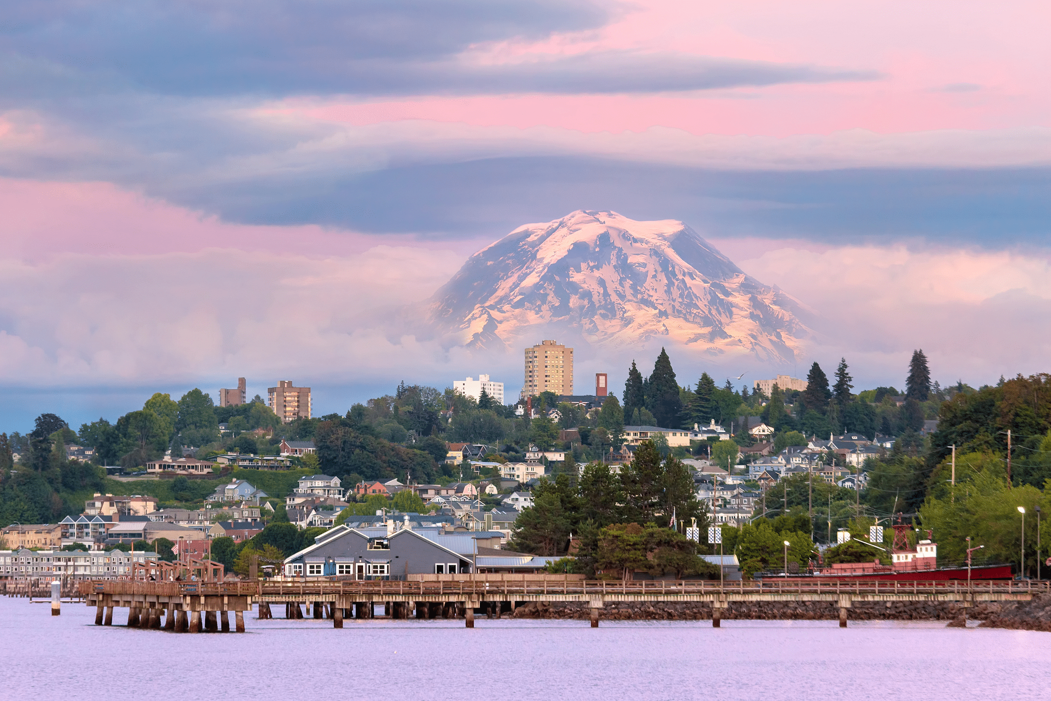 Mount Rainier over Tacoma Washington waterfront during alpenglow sunset evening