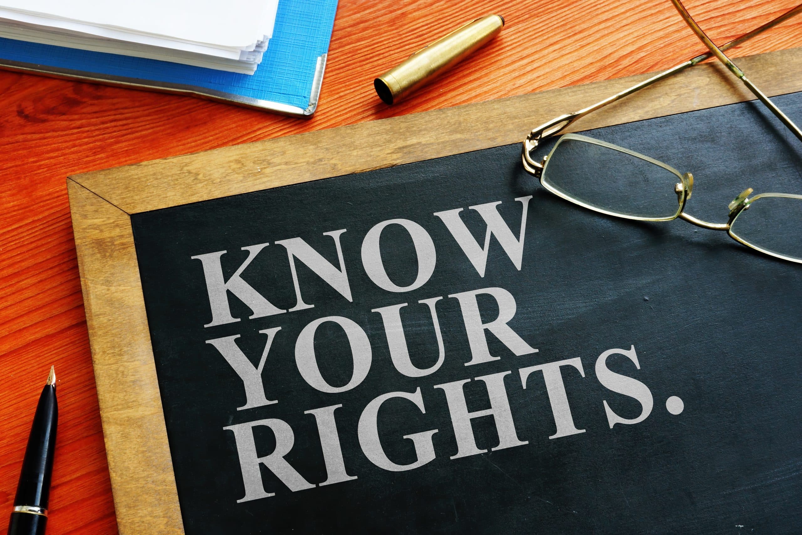 know-your-rights-workers-rights-on-chalkboard-next-to-glasses