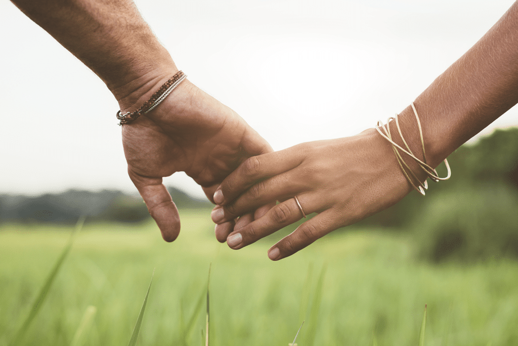 partner support pair of hands holding each other