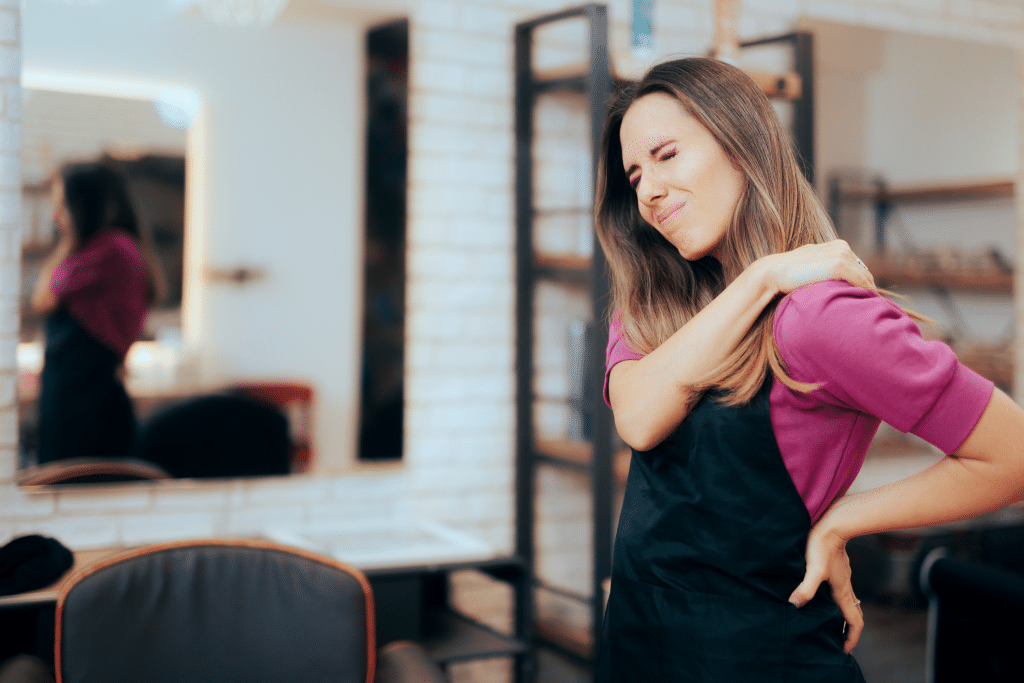 woman-in-an-apron-experiencing-chronic-pain-in-her-neck-and-back