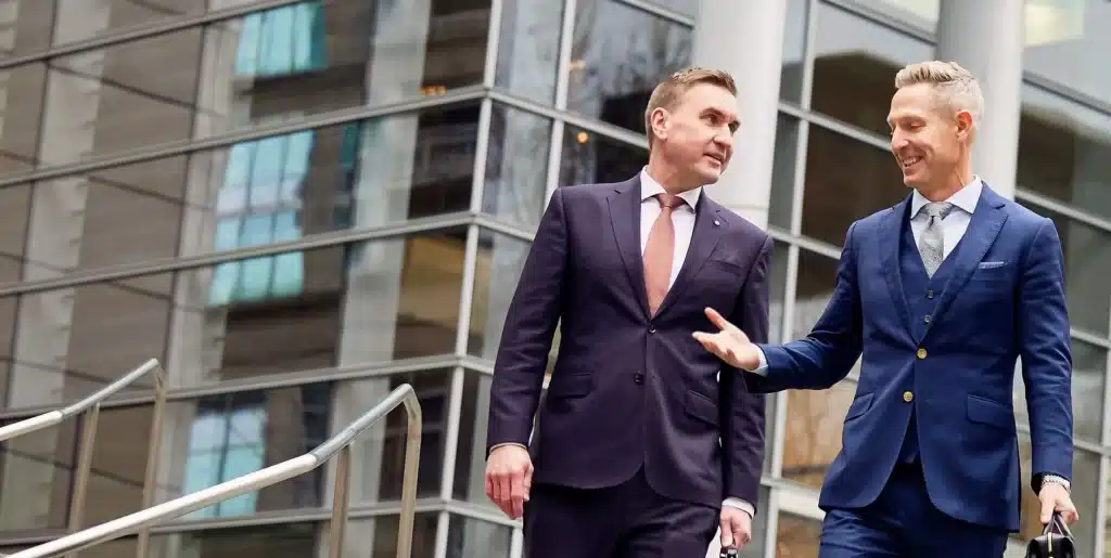 Timothy W. Emery and Patrick B. Reddy engaged in a conversation while on the move.