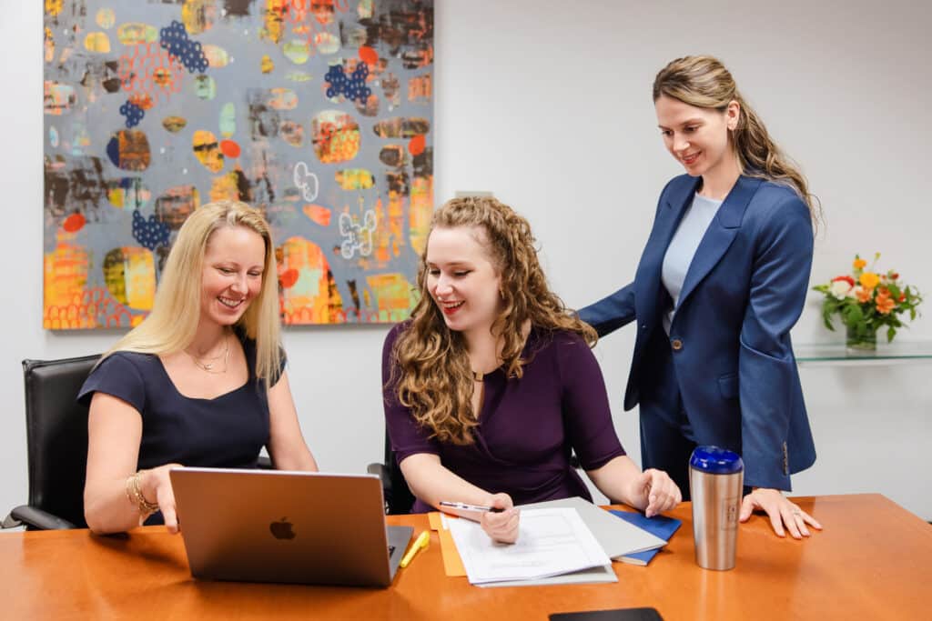 Emery Reddy Attorneys working on a claim in a conference room