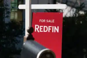 A lawsuit filed against Redfin alleges the Seattle-based real estate giant did not include wage scales or salary ranges in its job postings, as required by Washington law. (Elijah Nouvelage / Bloomberg, 2022)