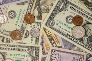 Background of different american dollars bills and coins