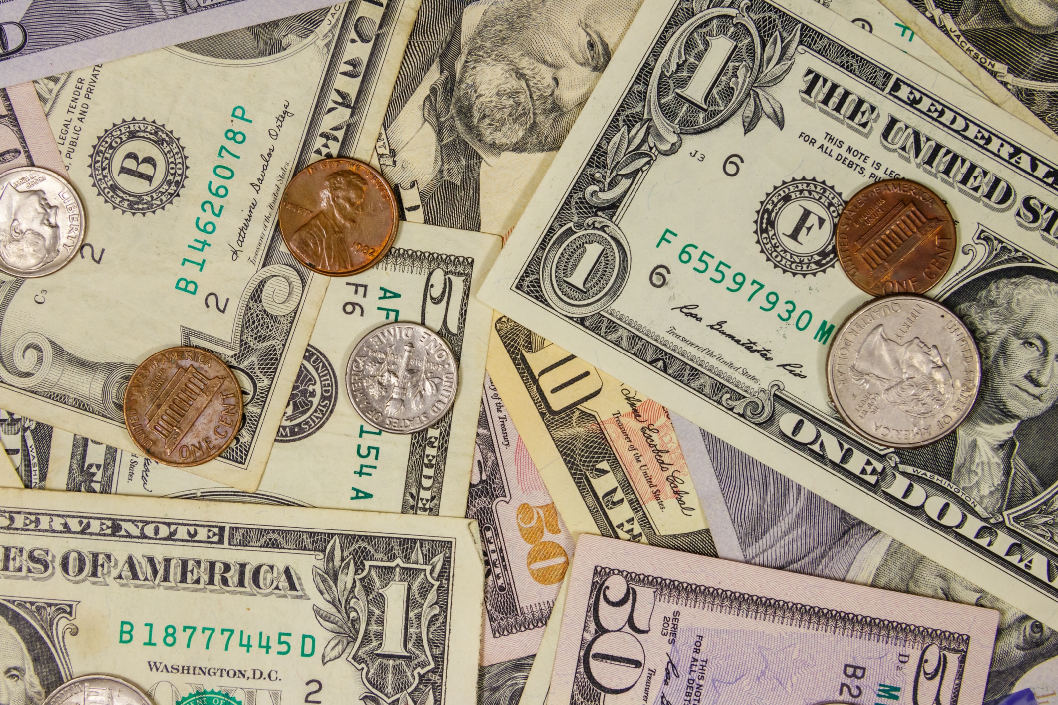 Background of different american dollars bills and coins