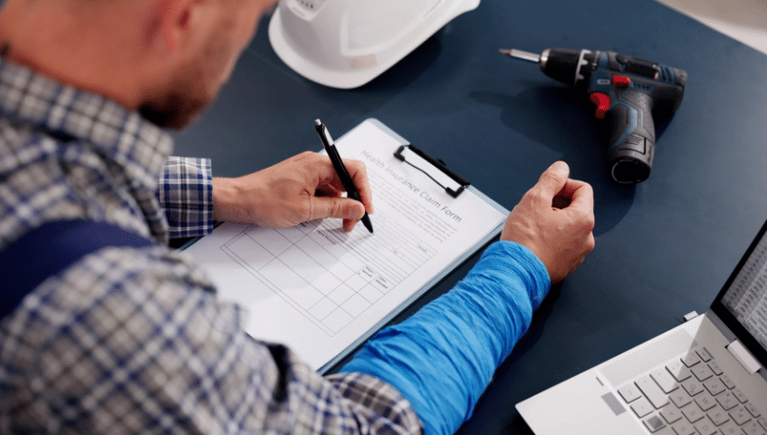 Injured worker filling out paperwork