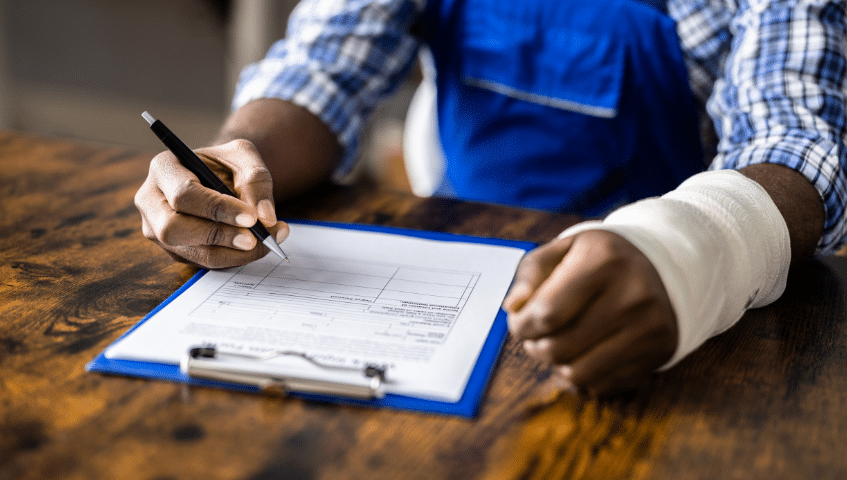 Injured worker completing forms